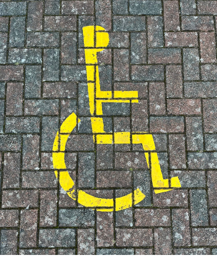 A-handicapped-sign-painted-on-a-brick-sidewalk-photo-–-Free-Disabled-parking-Image-on-Unsplash